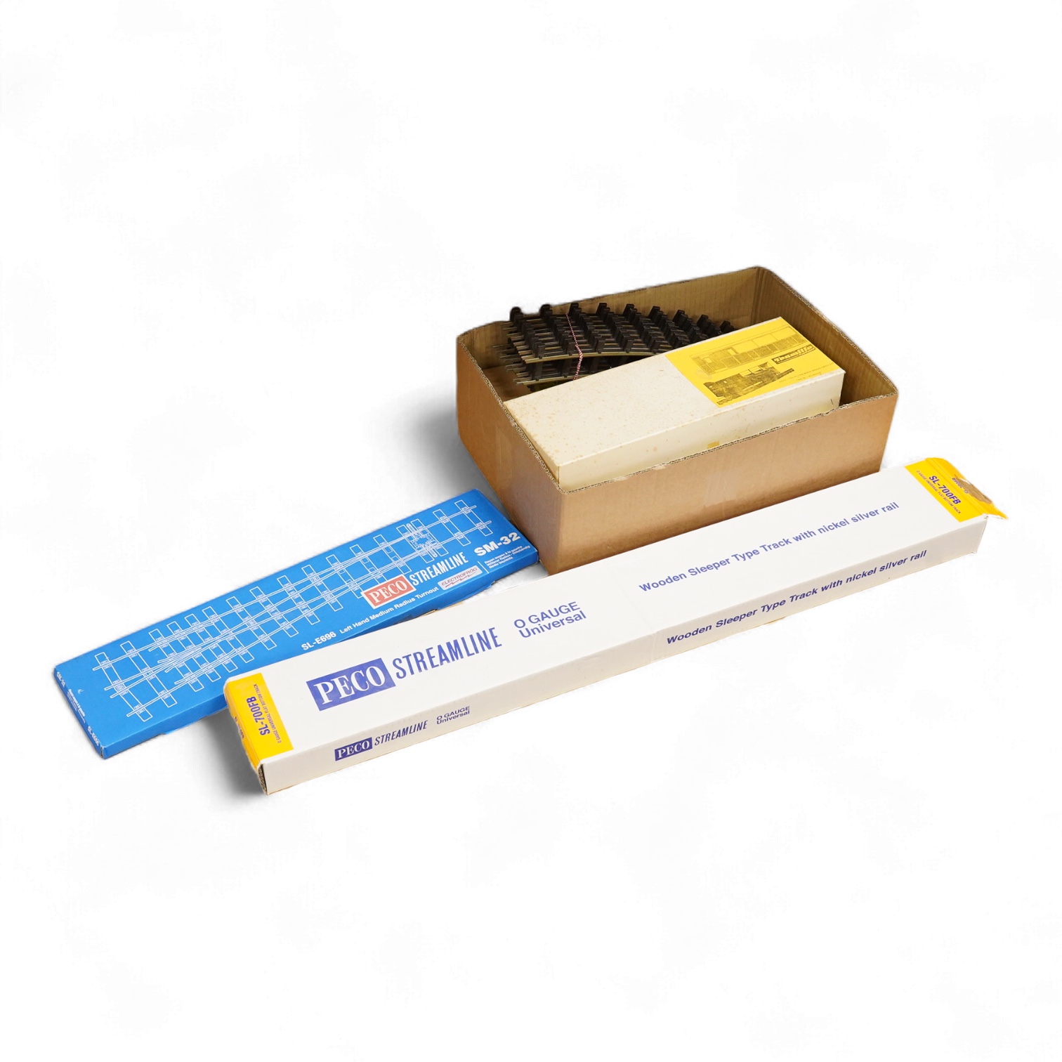 Four boxed Bassett-Lowke by Corgi 0 gauge railway freight wagons; a BR 20-ton brake van, together with two Southern Railways open wagons and a ventilated box van, together with a boxed Tenmille Products kit for a Talylly